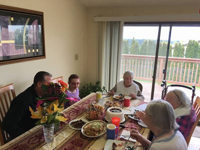 Residents enjoying a meal together in a dining area