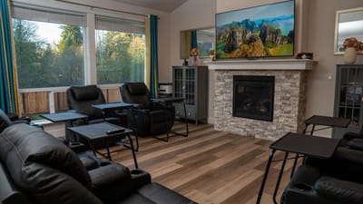 Cozy lounge area with recliners and a TV