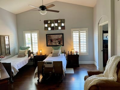 A shared room with two beds and a seating area