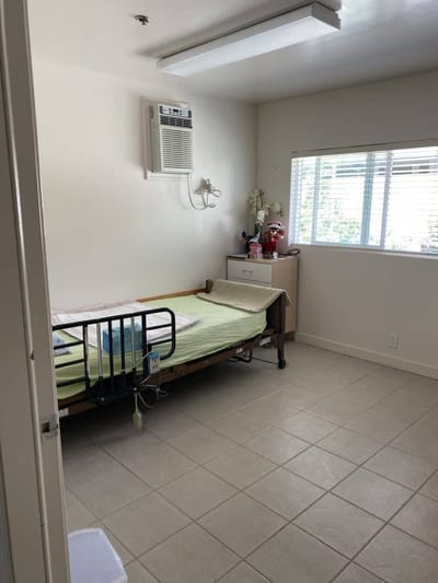 Private resident room with a hospital bed
