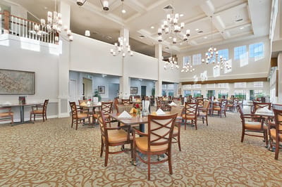 Bright dining room with elegant decor and tables set