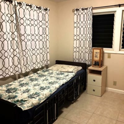 Private resident room with bed and window
