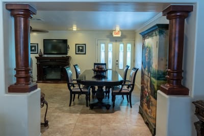Interior dining area with a large table and chairs