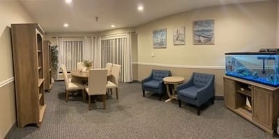 Interior common area with seating and aquarium