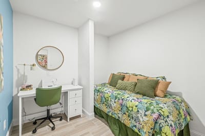 Cozy private resident room with a bed and desk