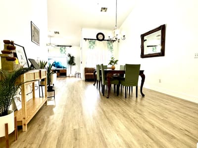 Dining area with green chairs and wooden table