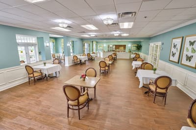 Bright dining area with tables and chairs
