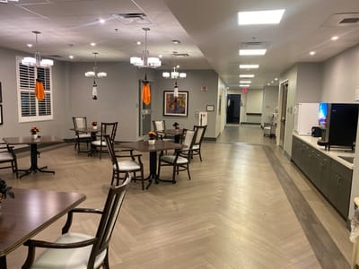 Bright interior common area with tables and seating
