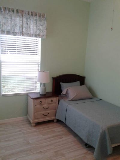 Small resident room with a bed and nightstand