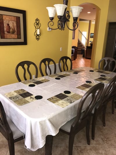 Dining table set in a brightly colored dining area