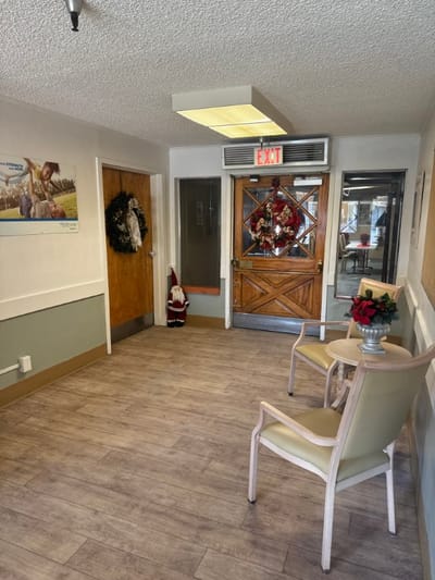 Interior hallway with holiday decorations and seating