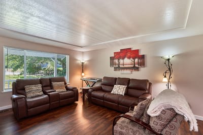Cozy common area with leather sofas and artwork