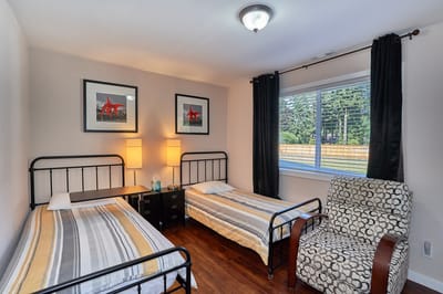 Cozy resident room with two beds and seating