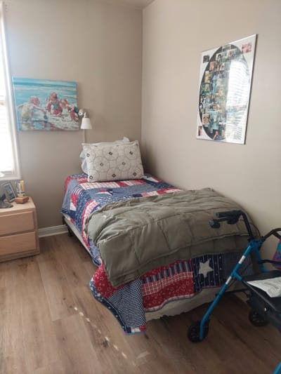 Cozy resident room with a bed and personal decorations