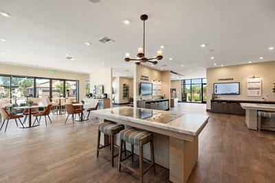 Bright common area with seating and kitchen space