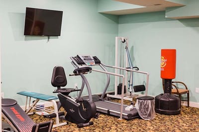 Interior view of a fitness room with exercise equipment