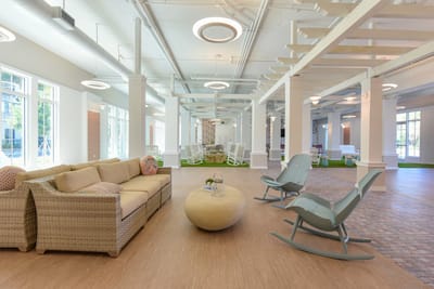 Bright common area with comfortable seating and natural light