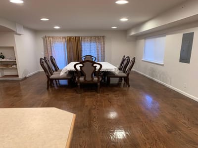 Interior dining area with a large table and chairs