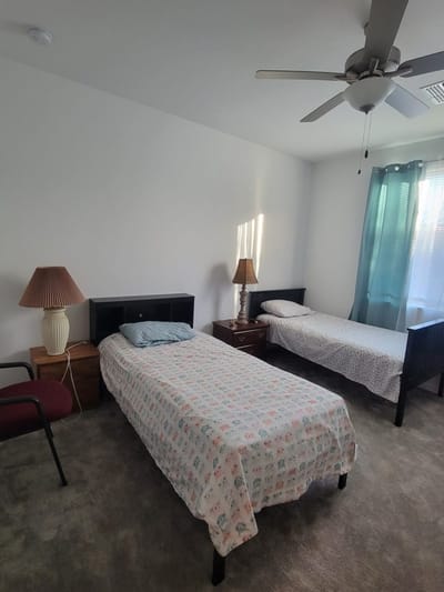 Private room with two beds and natural light