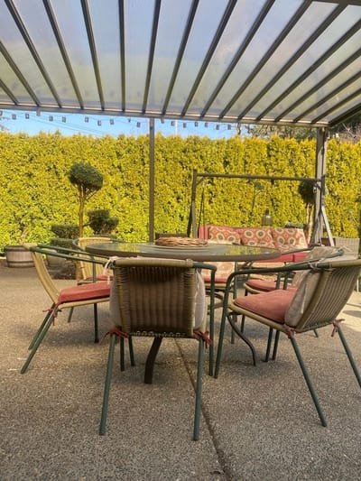 Outdoor seating area with a table and chairs