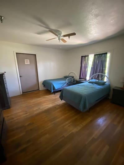 Cozy resident room with two beds and natural light