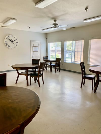 Bright common area with tables and chairs