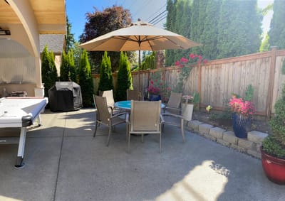 Outdoor seating area with an umbrella and floral decorations