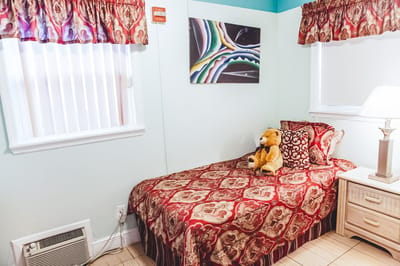Cozy private resident room with a bed and decor
