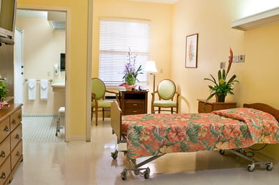 A well-decorated resident room with floral bedding