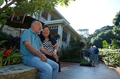 Residents enjoying time outdoors near the facility