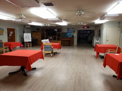 Interior view of a common area with red tablecloths