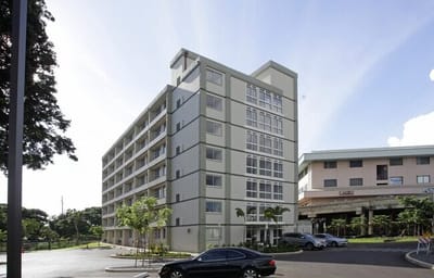 Exterior view of Hale Mohalu II facility with landscaping