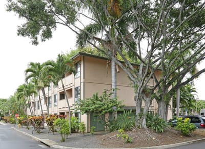 Exterior view of Hale Mohalu Senior Apartments surrounded by trees