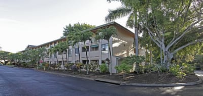 Exterior view of Hale Mohalu Senior Apartments with tropical plants