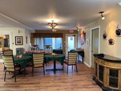 Dining area with tables and chairs in a warm interior