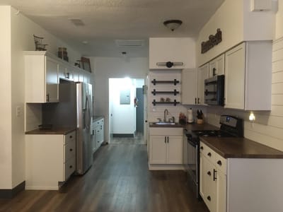 Modern assisted living kitchen with wood flooring
