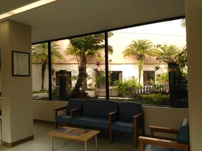 Bright lobby area with seating and garden view