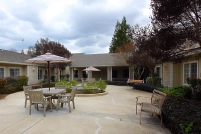 Outdoor courtyard with seating and shade umbrellas