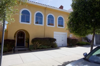 Front exterior of a vibrant facility with landscaped entrance