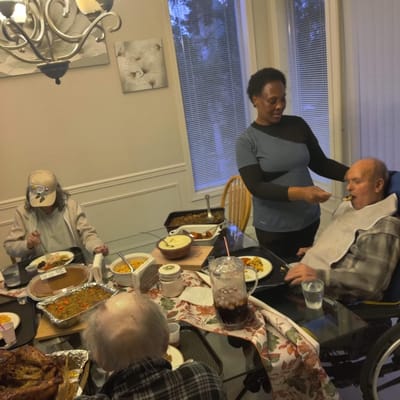 Residents enjoying a meal together in the dining area
