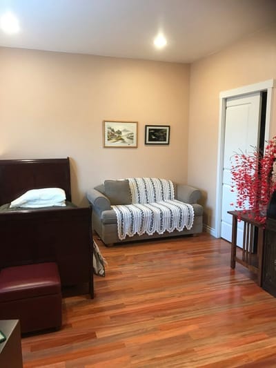 Cozy interior of a resident room with a couch and decor