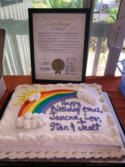 Birthday cake decorated with a rainbow and message