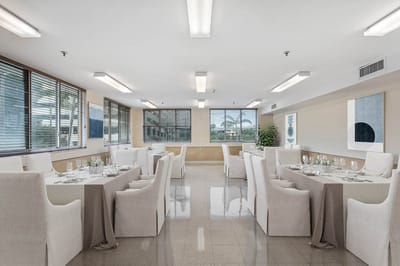 Bright dining room setup with tables and chairs