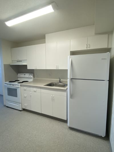 A clean kitchen area in a facility room