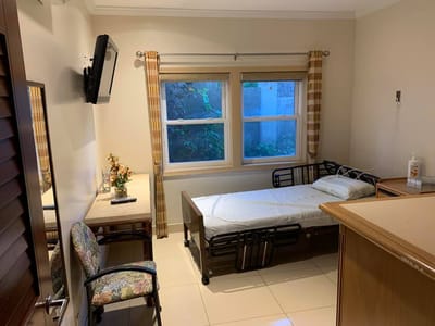 Private resident room with a bed and window