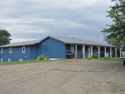 Exterior view of a blue assisted living facility