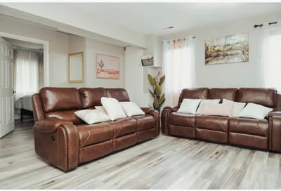 Cozy common area with leather sofas and artwork