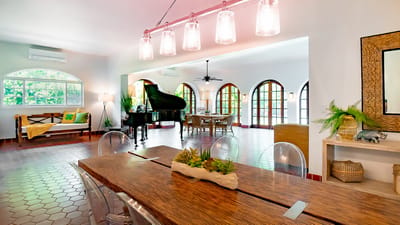 Bright common area with piano and seating