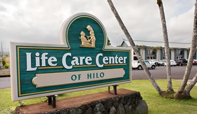 Facility logo in front of the building