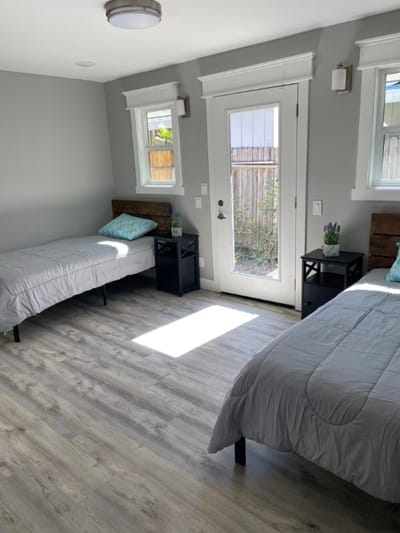 Brightly lit shared resident room with two beds